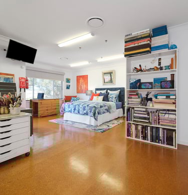 A warm, inviting view of the Artist Studio, blending creativity with comfort.