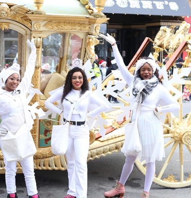 Snowflake skaters posing during a parade