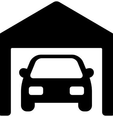 a car in a garage with a garage door open