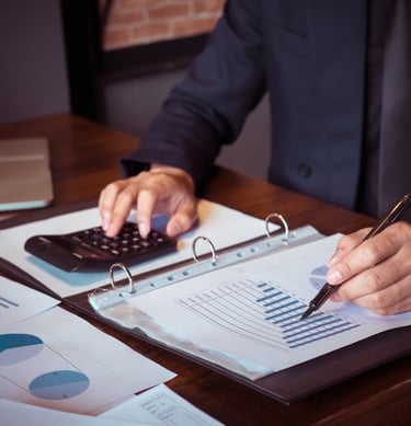 Auditor reviewing financial documents for audit procedures