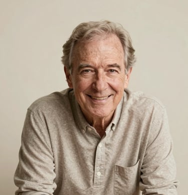 Portrait of a confident senior leaning forward, smiling warmly at the camera. Soft, cream-colored studio lighting. North American / US.