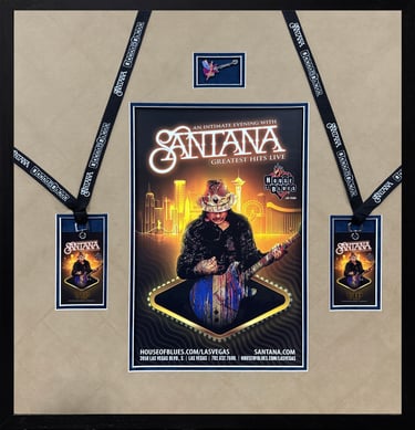 Framed Santana concert poster with VIP passes and guitar pin from the Greatest Hits Live show.