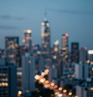 An artistic blur of city lights at dusk, using the palette colors #0D1B2A, #415A77, and #778DA9 to create an atmosphere of modern energy and creative possibility.