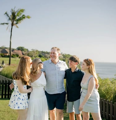 Family portrait overlooking the ocean during a family photography session at AYANA Resort Bali