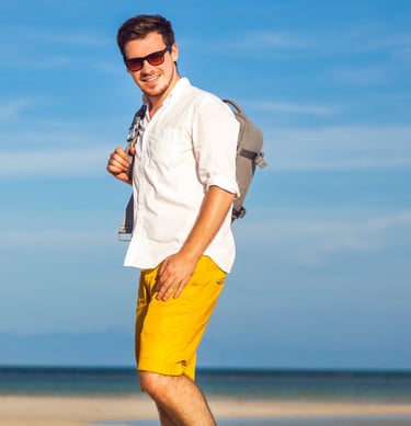 a man in a white shirt and yellow shorts