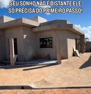 Modern house under construction with concrete walls under a blue sky for residential building projects.