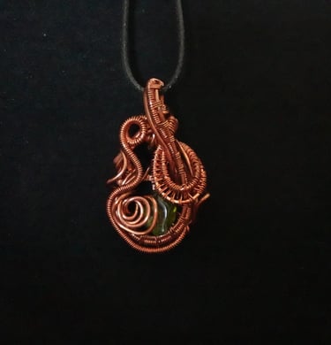 Peridot wrapped in Copper Wire
