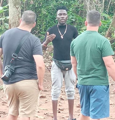 Dahomey African Tours Guide leading Tourists in the Sacred Forest in Ouidah in Benin