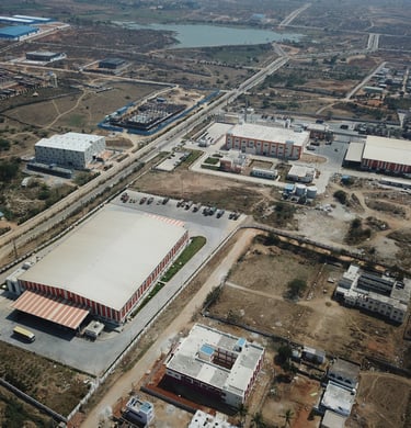 a large building with a large white roof and a large building