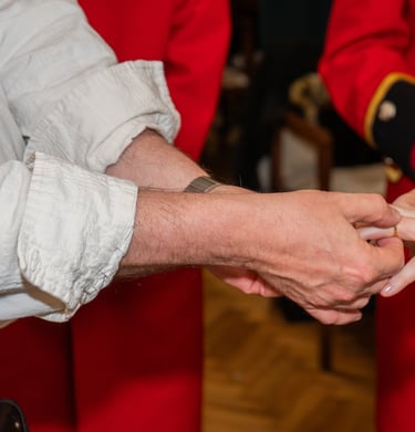 groom placing ring on brides finger