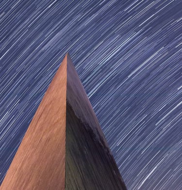 A composite image of star trails in the night sky and the tip of the Padre Pio Shrine in Landisville, NJ.