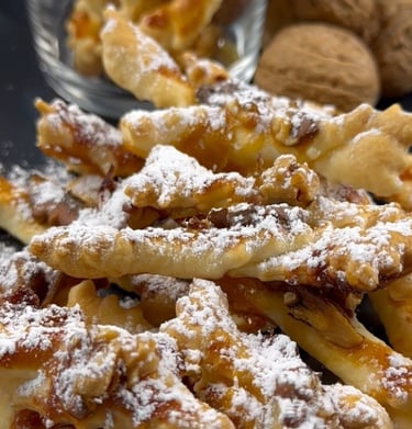 Biscottini di pasta sfoglia con marmellata e noci