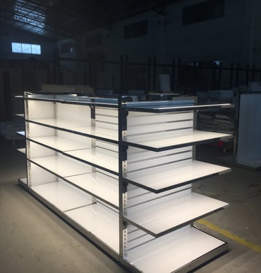 Double-sided white metal retail gondola shelving unit with integrated LED lighting for store displays.
