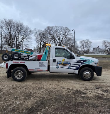 Side view of Ligfhtning Towing & Recovery truck ready for 24/7 service in Bourbonnais.