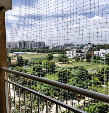 Completed pigeon net installation on a rooftop, blending seamlessly with the building structure.