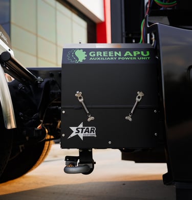 A Green APU auxiliary power unit Star Edition installed on a semi-truck chassis for idle reduction.