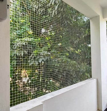 Elderly person enjoying fresh air safely behind a well-installed balcony net in Bellandur.