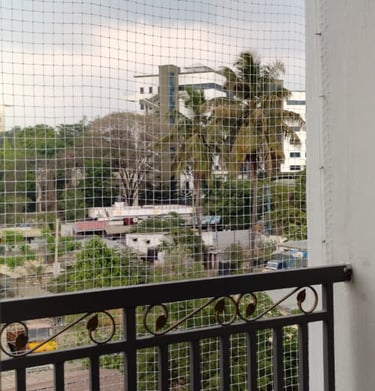 Installation process of balcony safety nets by Arjilli Enterprises technicians in Sholinganallur.