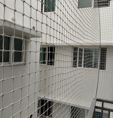 Close-up of the strong mesh material used in the balcony safety nets.
