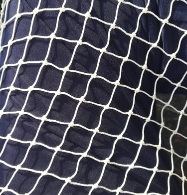 Detailed view of the net’s mesh pattern designed to keep pigeons out while allowing airflow.