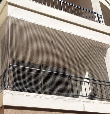 Installation process of invisible grills by Arjilli Enterprises team at an Alwarpet residence.