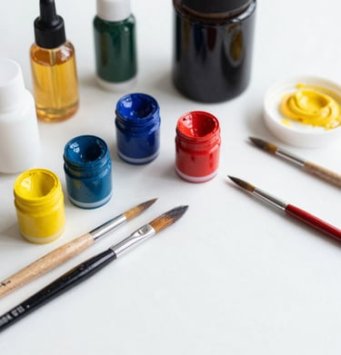 An artist’s workspace featuring sketchbooks, pencils, and watercolor palettes.
