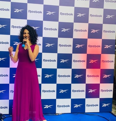 woman holding mike in an event