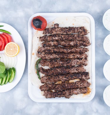 a plate of meat and vegetables on a table