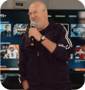 a man in a black jacket and a microphone