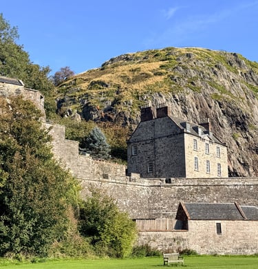 a castle with a mountain in the background