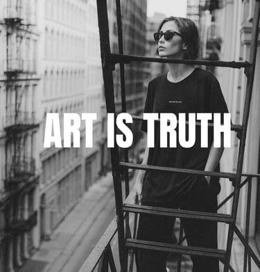 Black-and-white photo of a model on a fire escape wearing a NOVIP tee  ‘ART IS TRUTH'.