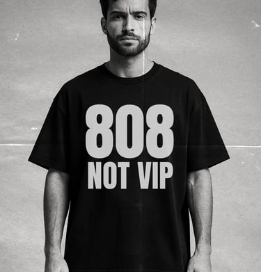 Black-and-white portrait of a man wearing the NOVIP ‘808 Not VIP’ oversized T-shirt.