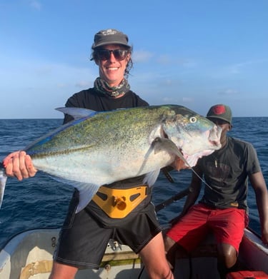 Angler showcasing a Bluefin Trevally on a Full-Day Fishing Charter in Zanzibar