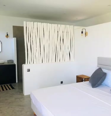 a bed with pillows and pillows on a bed