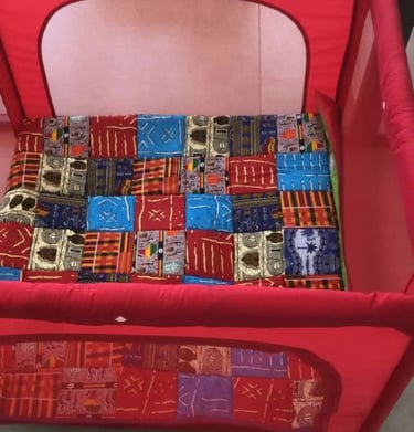 a baby's playpen with a red playpen