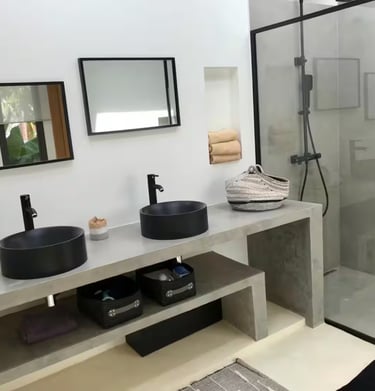 a patio with a couch and chairs and a television