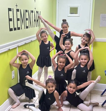 a group of young girls in black leoperlance outfits FANTASTIC LAND LEARNING CENTER