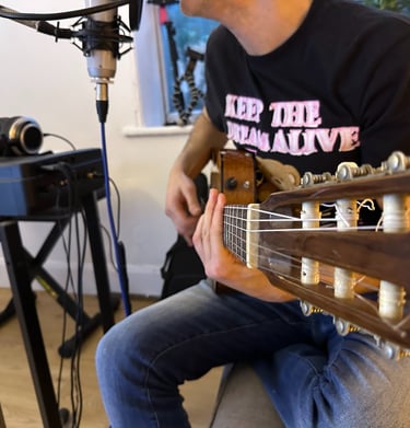 George Papakyriacou in the studio recording acoustic guitar