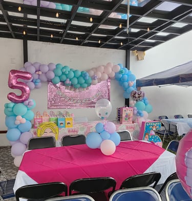 a table with balloons and balloons on it
