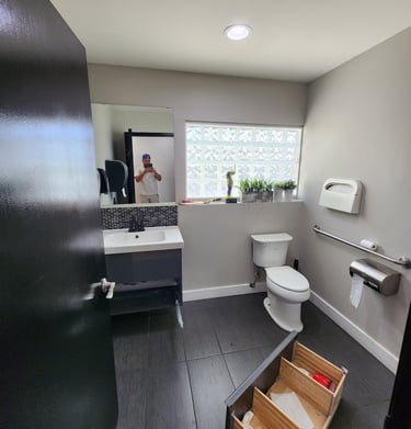 a bathroom with a toilet and a sink