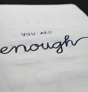 Handwritten affirmation ‘You are enough’ in faith journal, a message of divine identity