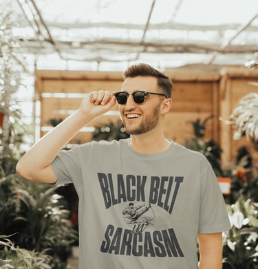 Man wearinf black belt in sarcasm tshirt designed by austistic artist