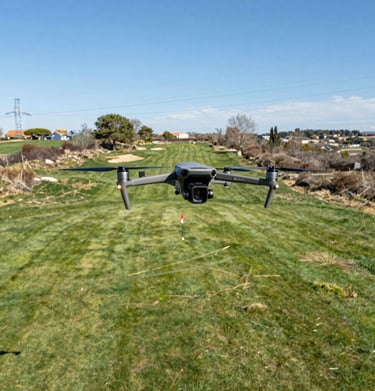 Wingtra Ray drone preparing for a flight over a large agricultural field.