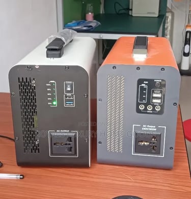 Portable power stations with AC outlets and USB ports on a wooden desk for emergency backup.