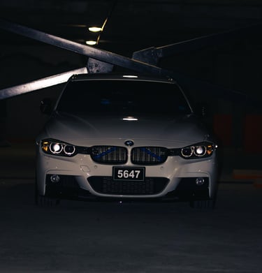 night shot of a white bmw active 3 3 series