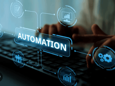 a person typing on a keyboard with a laptop make automation