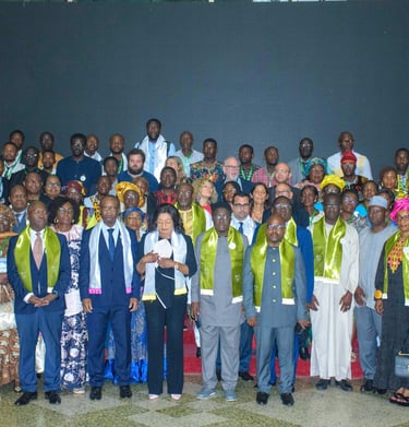 A large group of international delegates posing for a formal portrait at a global summit conference.