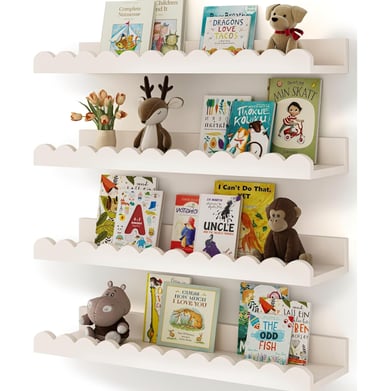 White wavy floating bookshelves in a nursery featuring children's books and stuffed animals.