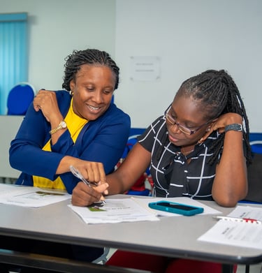 two female co-workers solving a problem from a case study