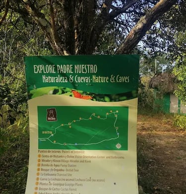 Map of Padre Nuestro nature and caves trail in a tropical forest setting near a green hut.